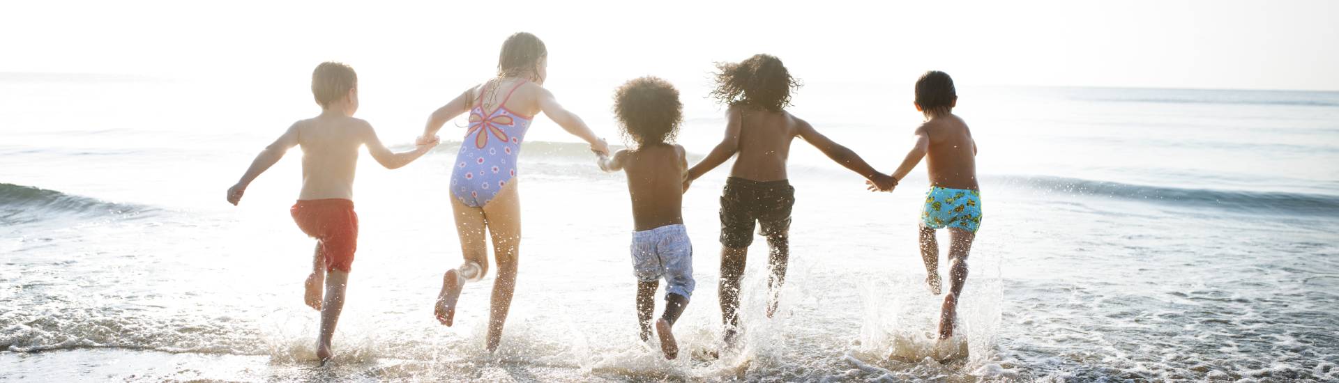 Kids playing in the ocean